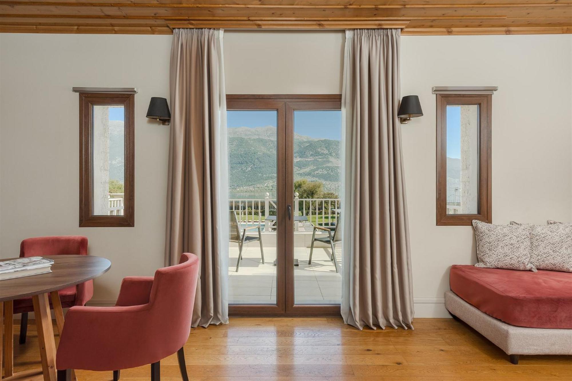 The Lake Hotel Ioannina Exterior photo Curtains in a living room